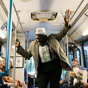 This scene from the original play Good Person of South Fayetteville, created and produced by Artist's Laboratory Theatre, Fayetteville, Arkansas, featured actor Kerry Crawford shown performing on an Ozark Regional Transit bus. The play was developed as part of the Southside Civic Lab project. Photo Credit: MGB Photo
