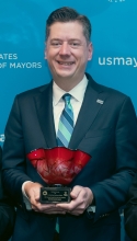 Mayor Holt holds his Public Leadership in the Arts Award