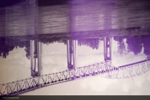 A detail of the artwork shows an upside down bridge tower and the purple dot-matrix pattern of the artwork.