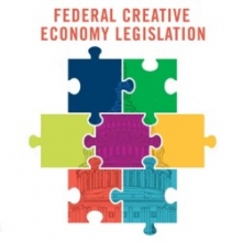 Image of seven colorful puzzle pieces fitted together under the header "Federal Creative Economy Legislation"